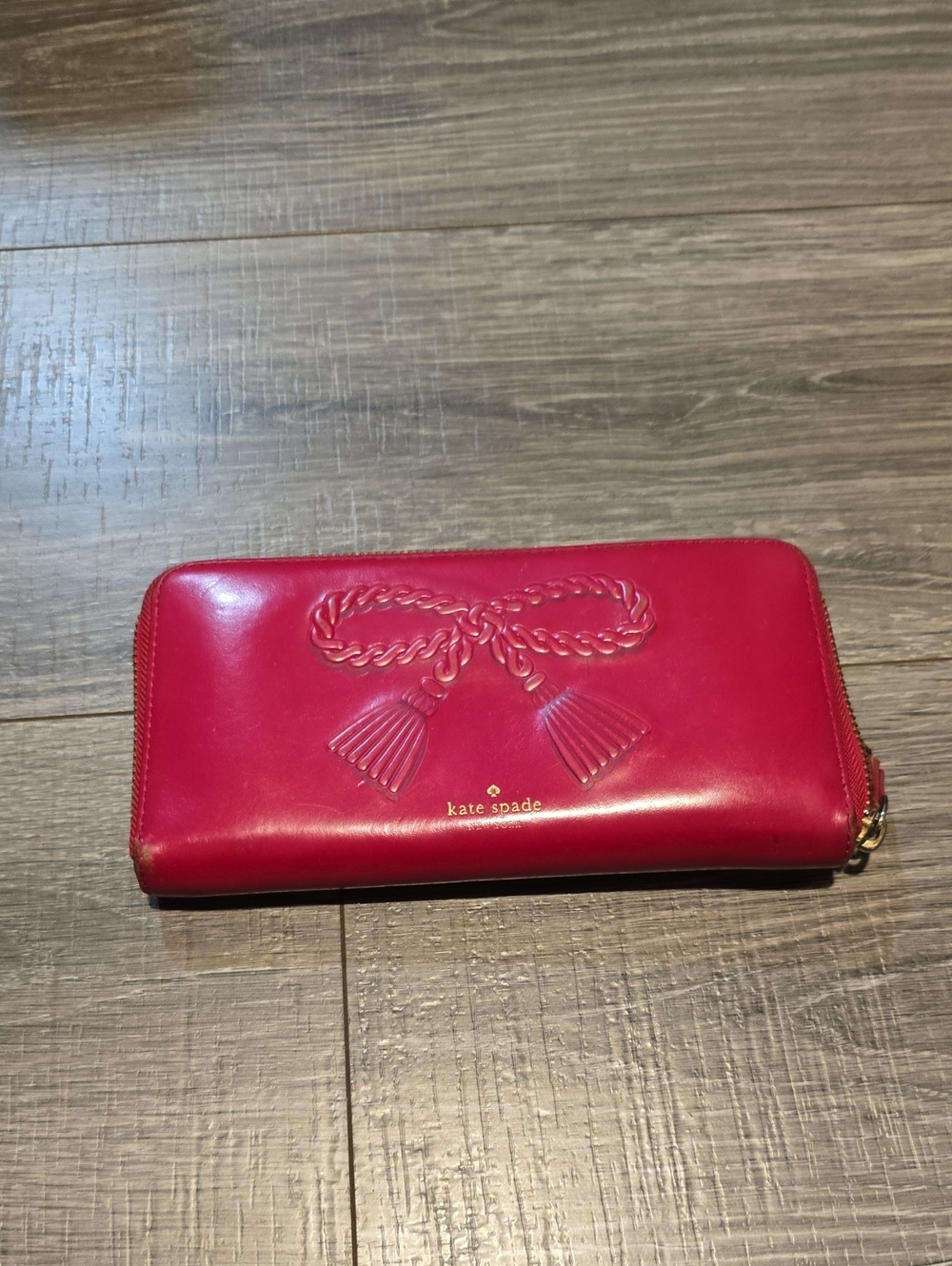 kKate Spade New York Pink Tassel Zip Around Wallet.